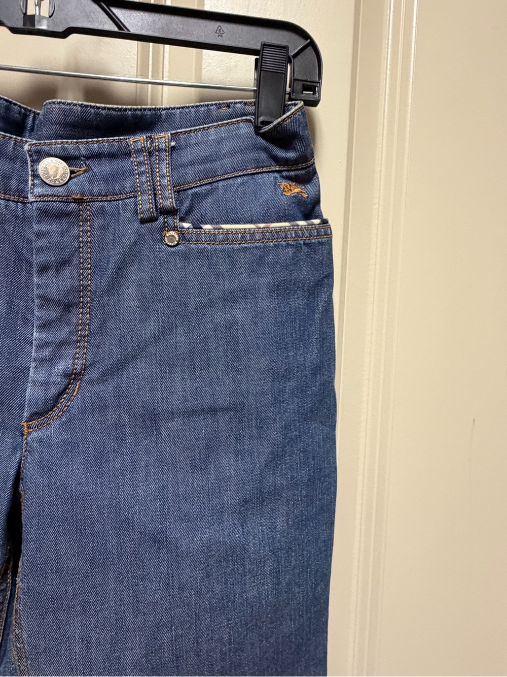 Burberry Blue Denim Jeans with Nova Check Trim. Iconic Burberry Logo on front